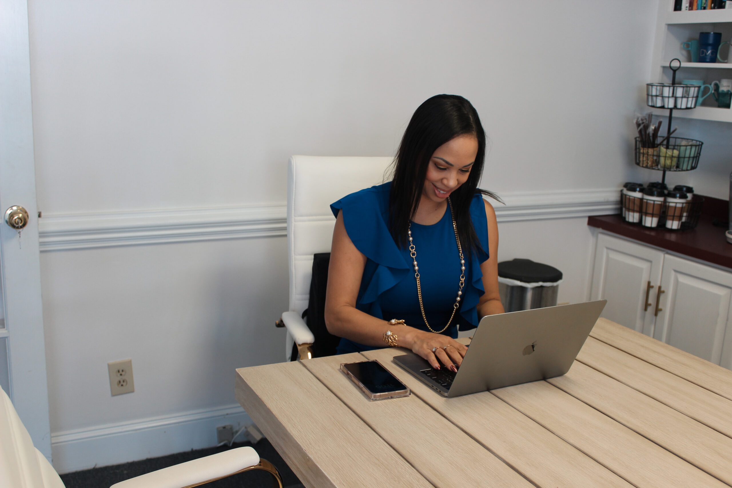 Woman using laptop | DMG Center Clayton NC Co-Working Space